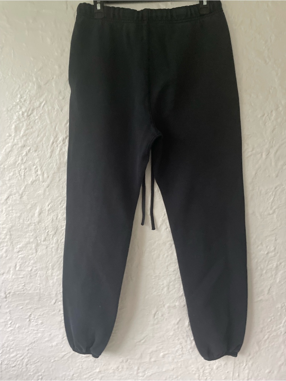 Fear of God Essentials black sweatpant joggers, drawstring, pockets; size S